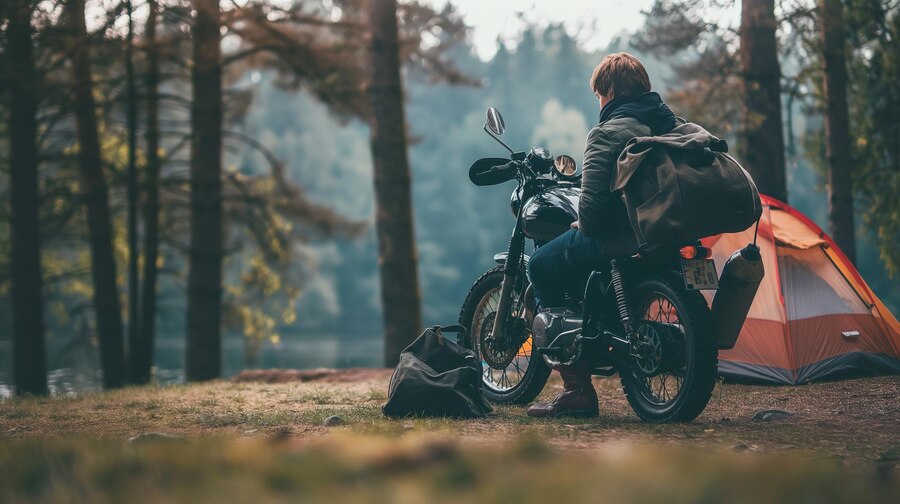 The Best Motorcycle Camping Gear Guide for 2024 1 solo-motorcyclist-enjoying-peaceful-camping-trip-forest